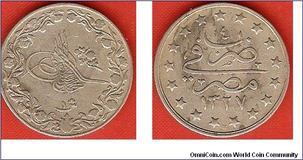 1 qirsh
in the name of Muhammad V
accession year 1327AH
regnal year 4
copper-nickel
Heaton Mint