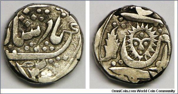 Princely States, Indore, Shah Alam II, Rupee. Circa 1825. 11.09g, Silver, 17.2mm. Thick: 4.5mm (The coin is so thick, look like Strepsils...) Obverse inscription: 'Shah Alam II'. Reverse: Sun face. Mint: Malharnagar. VF+/XF.