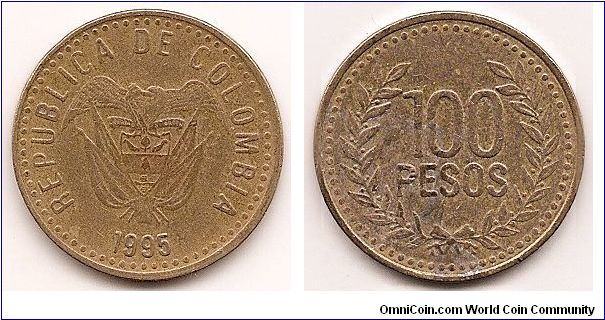 100 Pesos
KM#285.2
Brass Obv: Flagged arms above date Rev: Denomination within wreath, numerals 6mm tall Note: Edge varieties exist.