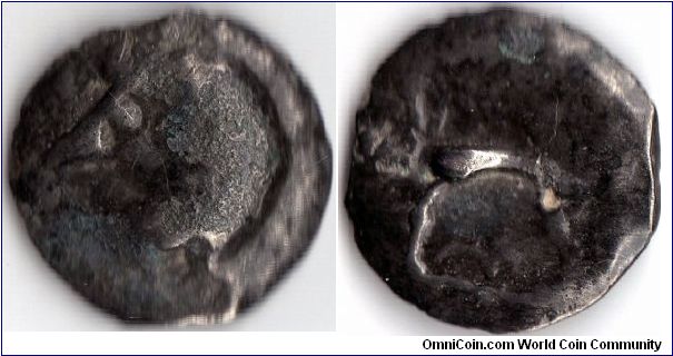 Potin a la tete chauve et nez longue (bald head and long nose)of the Leuci tribe from Northern Gaul whose capital was Toul in France. This coin was produced circa 80 BC. Reverse symbolises a boar with a fleur de lis beneath.
