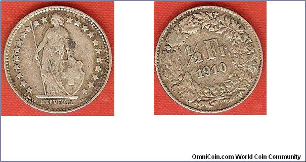 1/2 franc
coin alignment
22 stars around figure of Helvetia
0.835 silver
