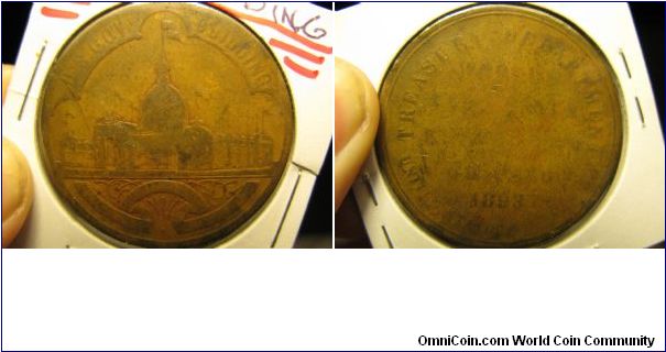 1893 Colombian Exposition token. It was only a dollar. :-)