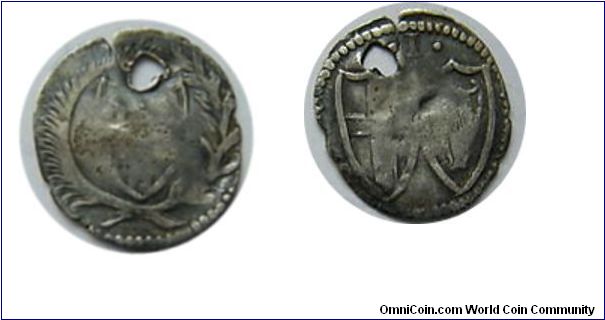 Commonwealth Penny
Obv.Wreathed Shield.
1 above two shields.
Holed