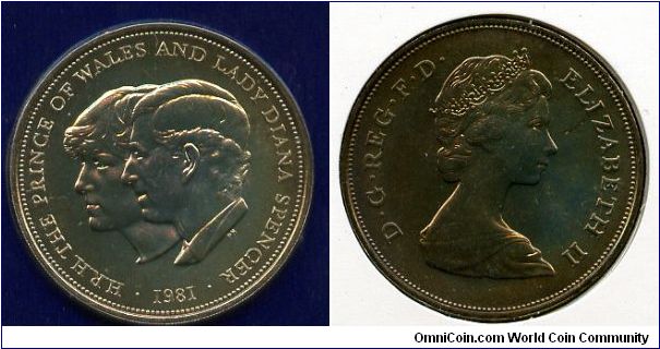 Crown (25p) in folder
Wedding of HRH The Prince of Wales and Lady Diana Spencer 
Designed by Philip Nathan
Portraits of Lady Diana Spencer partially & HRH The Prince of Wales, facing to the left
Queen Elizabeth II by Arnold Machin