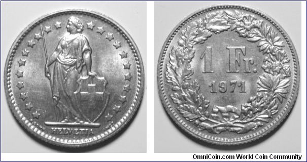 1 Franc (Copper-Nickel) : 1968-1981
Obverse: Helvetia standing holding spear and shield with cross on it 
 HELVETIA 
Reverse: Value within wreath 
 1 Fr date