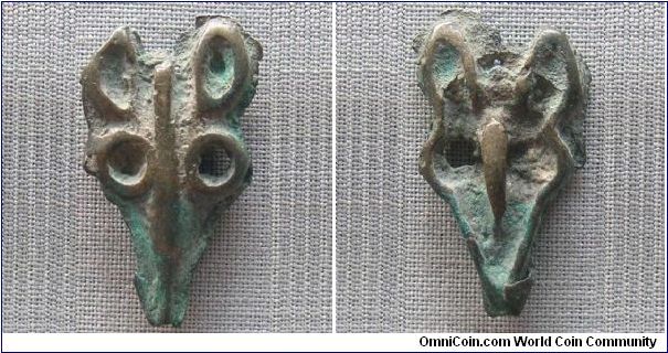 Ordos Late Bronze Age (1600-1200 BC), deer face money. This deer face money was excavated in Chifeng, Inner Mongolia. The Ordos culture comprises the period from Upper Paleolithic to the late Bronze Age at the Ordos Desert. The Ordos area were predominantly Mongoloid known from their skeletal remains and artifacts, but numerous interactions between Europoid & Mongoloid might had also taken place there over the course of several centuries, until its occupation by Qin & Han. Very rare.
