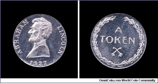 1927 aluminum Elder token with a bust of Lincoln. Size of a gold dollar.