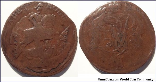 AE 2 kopecks 1758 or 59. Overstruck on top of an error double struck 1 kopeek 1755/6, the obverse shows 3 eagle wings and 2 sets of clouds. Netted edge.