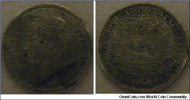 a chewed up 1945 1/2 bolivar.