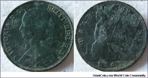 1862 halfpenny, reverse has rock between rim and lighthouse, been dug up hence the condition