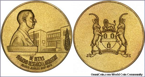 Large 50.6mms, 74.0 grams, eighteen carat gold medallion, issued for the silver jubilee in 1972, of the Diamond Research Laboratory, opened in 1947. We guess it is Ernest Oppenheimer on the obverse, but do not know whether the building is in London, Johannesberg, or where? It's unlikely to be New York. Anybody know?