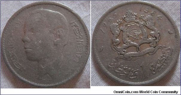 earlier 1 dirham from 1964, shows its wear as it is aluminium