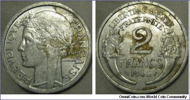 lustrous 2 francs... would be UNC if it wasn't for the brown marks