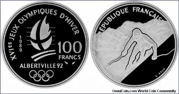 It's all downhill from here! French silver proof 100 Francs featuring DH skier. Patrick Ortlieb (AUT) won gold at Val D'Isere, Kerrin Lee-Gartner (CAN) won the Women's DH gold at Meribel. If I remember correctly Meribel created a new piste for the Women's Downhill, called La Face. It's quite steep, daunting, and has quite a jump on it.
