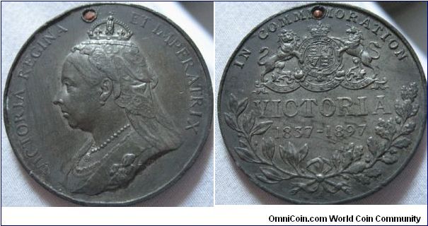 40mm jubilee medal from 1897, in silver, not in perfect condition and is holed. also a H for heaton mint
