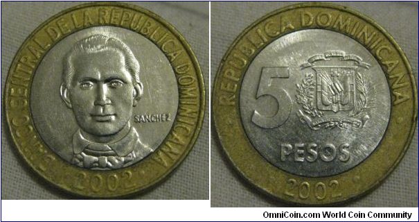 nice 2002 5 pesos, worn dye on the outer piece as you can see from the worn looking lettering