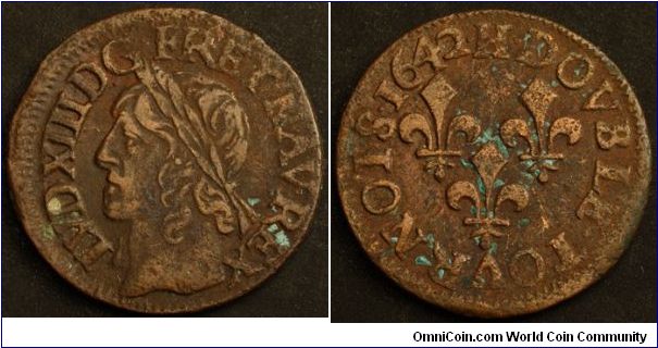 Louis XIII (1610-43 AD), Double Tournois, 1642H. 3.05g, Copper, 19mm. Mint: La Rochelle. Obverse: Laureate bust of Louis XIII left. Legend: LVD XIII DG FR ET NAV REX. Reverse: Three fleur de lis symbols. Legend: 1642 H DOVBLE TOVRNOIS. Good fine to about very fine.