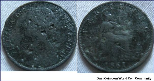 1861 farthing, thinner date variaty, pitted and worn sadly, otherwise it would be aVF