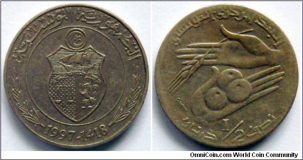 1/2 dinar.
1997, F.A.O.