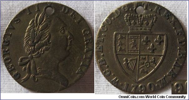 guinea like token made of brass nice doubling on the 9 and reminets of an early shield engraving., holed, perhaps a forgery or a victorian gaming chip