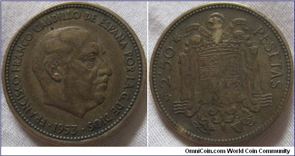 2,50 peseta coin, wonderful looking coin, even though it has seen circulation it adds to the coin dramatically, also a 19 in the star indicating 19+1953