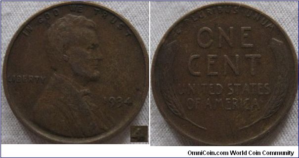 1934 wheat cent, fine grade, interesting mark near the 4. better then the average definatly