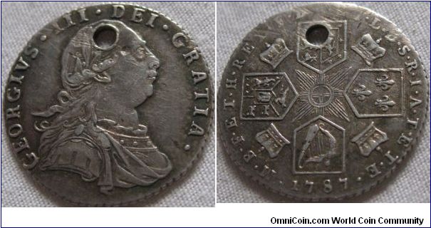 1787 shilling, VF but holed, hearts in the shield and some toning in the lettering