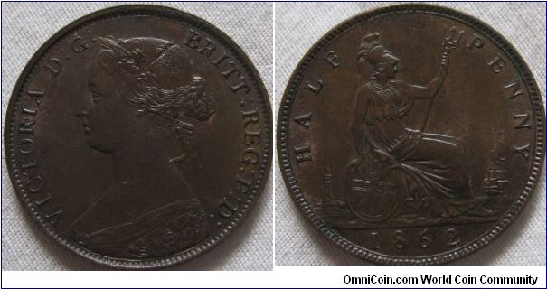 gorgeous 1862 halfpenny, coin has partial lustre, let down by a scratch in the hair