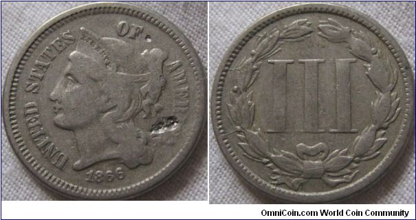 1866 3 cents, not silver, fine condition looks like some chips have been taken out of obverse