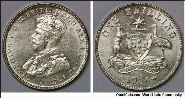 George V Shilling, 1936 Melbourne Mint mark M. Crisply struck with all 8 crown base pearls sharp. Just a few scattered tiny marks, only notable is the hairline between the O and N of 'ONE' and it is less noticeable when viewed directly. It's still an uncirculated example.