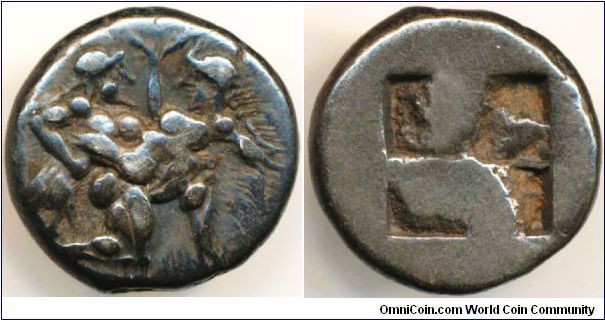 Famous silver drachm, c.525-463 B.C., 3.9g, 15mm, 2mm thick. Obv. Naked ithyphallic Stayr in kneeling, running attitude right carrying in his arms, a struggling Nymph who raises her right hand in protest. Rev. Quadripartite incuse square. The Satyroi with animal-like worthless man who performs no useful tasks & is only interested in following his baser instincts. This coin type can be thought of as both a model to be guarded against & an erotic celebration of the natural state of the universe.