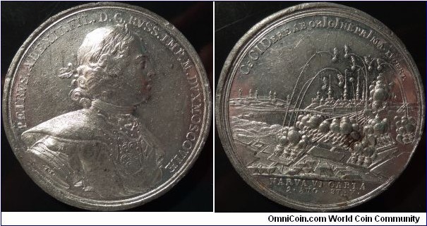 Medal commemorating the capture of Narva, 1704.
Bust of Peter I, laureated, cuirassed, and draped, r.
obverse legend: 	PETRVS . ALEXII . FIL . D. G. RVSS . IMP. M. DVX MOSCOVIAE [PETER ALEXEEVICH BY THE GRACE OF GOD RUSSIAN EMPEROR AND GRAND DUKE OF MOSCOW]
reverse type: 	View of Narva bombarded by Russian artillery batteries, Ivan-Gorod to left of Narva River
reverse legend: 	CeCIdere ab orIgIne prIma . lvcert/in ex: NARVA VI CAPTA / 9 . AUG . ST. V. Diakov 21.11  