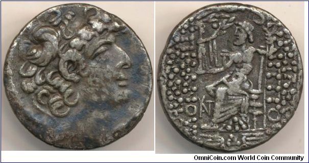 Syria Seleukid Kingdom  Philip I Philadelphos (93 -83 B.C.) Silver Tetradrachm. 14.9 grams, 27mm. Obv. diademed head right, fillet border. Rev. Zeus enthroned left holds Nike and sceptre on right, inscription before and behind monograms below.