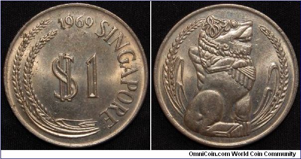 Singapore 1969 1 Dollar
16.8500 g., Copper-Nickel, 33.3mm.
Obv: Value and date
Rev: Statue flanked by sprigs
Edge: Reeded
Mintage: 1,871,000