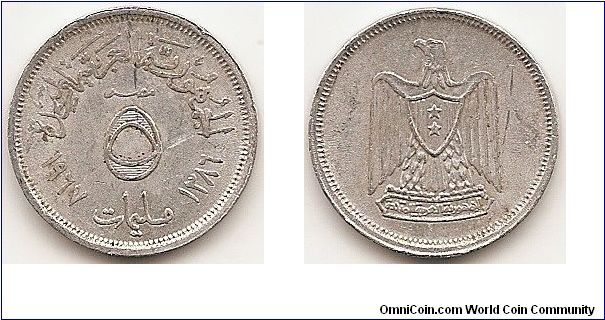 5 Milliemes -AH1386-
KM#410
Aluminum, 21,3 mm. Obv: Denomination divides dates Rev: Eagle with shield on breast