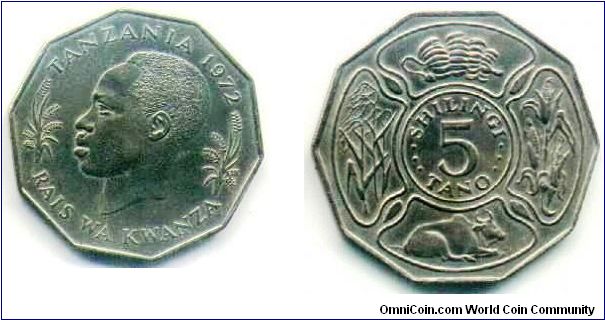 nice looking 5 shilingi coin showing bananas,rice, maize, & a cow
33mm diameter, nine sided coin