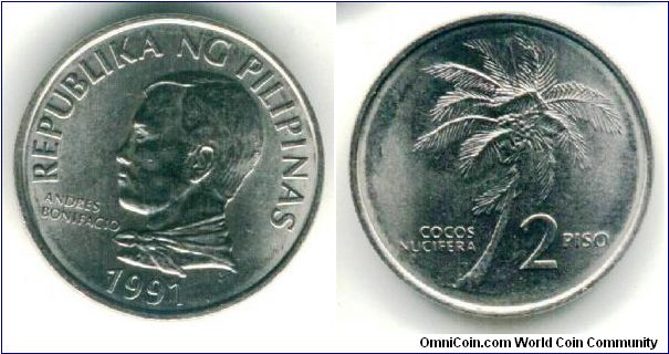 nice coconut tree
23.5mm diameter coin 
two pesos