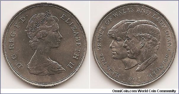 25 New Pence (Crown)
KM#925
Copper-Nickel, 38.5 mm. Ruler: Elizabeth II Subject: Wedding of Prince Charles and Lady Diana Obv: Young bust right Rev: Jugate heads left, H.R.H. THE PRINCE OF WALES AND LADY DIANA SPENCER