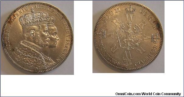 1861 thaler - Prussia. Subject: Coronation of Wilhelm and Augusta. I won this coin in a contest at http://coinauctionshelp.com/TPGS_FORUM/phpBB3/index.php . That website is great and I have created several silver coin value charts for coins of the world that you can view absolutely free, along with many other great guides about world and U.S. coins created by other members who are very well versed in what they write about.