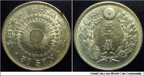 Japan 1909 50 sen. Cleaned but nice example. 10.1 grams.