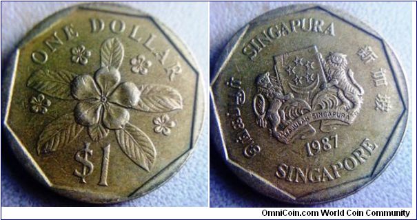 Singapore 1 Dollar in brass 
22.4mm diameter