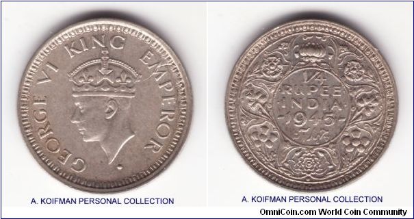 KM-547, 1945 British India quarter (1/4) rupee, Bombay mint (dot under the flower on reverse); silver, security edge; good extra fine to about uncirculated condition, strike through going through the M and a small rim bump on reverse, this is a high dot variety