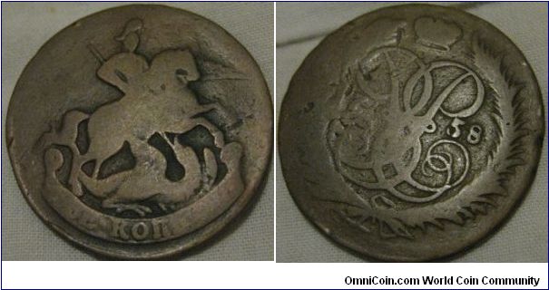 1758 2 kopeck, pretty worn, obverse and reverse are not aligned though, making it slightly more interesting