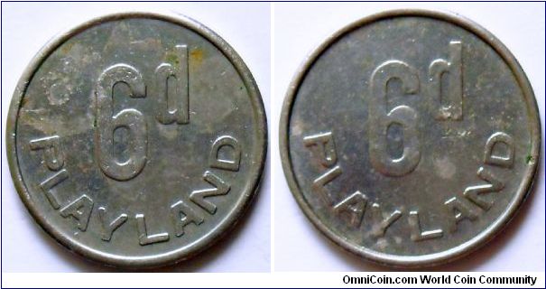 6 pence Playland token. Cu-ni. Diameter 18,88mm.