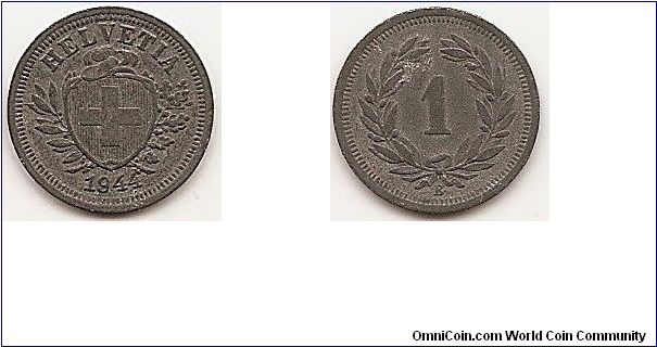 1 Rappen
KM#3a
Zinc, 16 mm. Obv: Cross in shield Rev: Value within wreath
