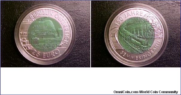 A nice unc. 25-euro railway commemorative, with a silver outside ring and a niobium inner ring colored green.  Beatiful images of historical and modern locomotives as well as a scene of a bridge.  One of my favorites!