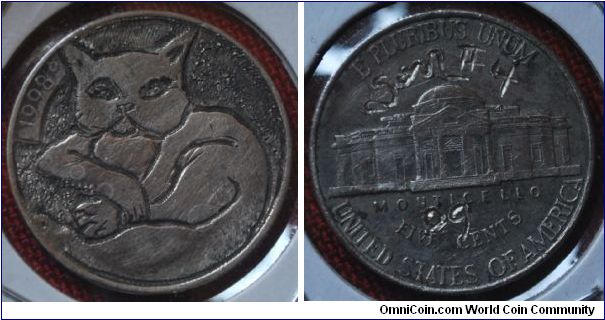Pocket Art by artist SnowBlind.  A cute kitty on the front of a Jefferson Nickel.