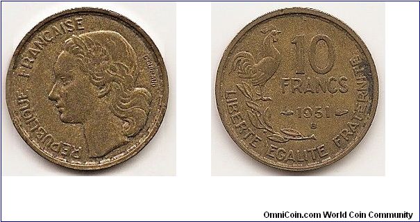 10 Francs
KM#915.2
Aluminum-Bronze, 20 mm. Obv: Head left Rev: Rooster above laurel sprig, denominaton at right