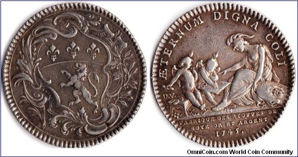 Rare silver jeton issued for the manufacturers of silk materials in silver and gold at Lyon.