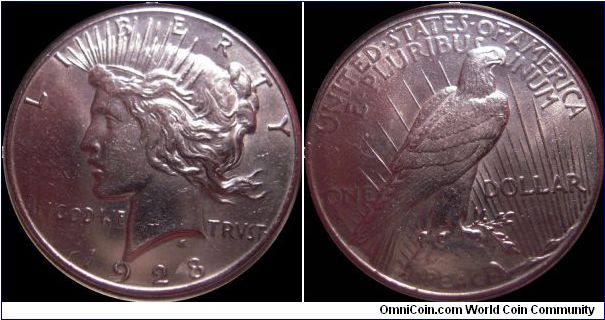 1928 $1 - silver Peace dollar struck at the Philadelphia mint. This is one of two keys of the series at a mintage of 360,649, almost 500,000 less than the next rarest. I'd give it about MS-64.